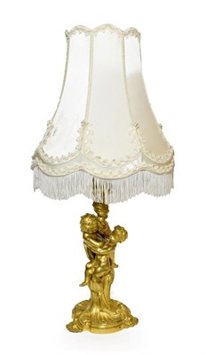 Lot 378 - A French Gilt Bronze Table Lamp, 19th century, as two cherubs holding a wrythen foliate column on a