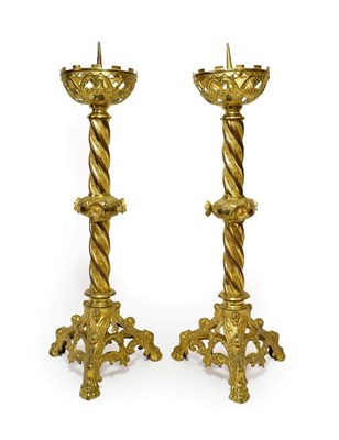 Lot 381 - A Pair of Neo-Gothic Gilt Metal Candlesticks, mid 19th century, with pierced scroll cast drip pans