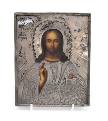 Lot 386 - A Russian Icon, late 19th century, decorated with Christ Pantocrator, the silver oklad with...