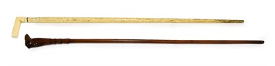 Lot 397 - A Whalebone Walking Stick, late 19th century, with angular ivory handle, 84cm long; and A...