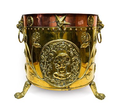 Lot 416 - A Dutch Brass and Copper Log Bucket, 19th century, with lion mask and ring handles over relief...