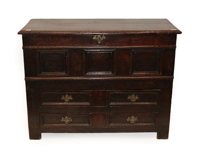 Lot 427 - A 17th Century Joined Oak Chest, the moulded hinged lid above three fielded panels, the base a...