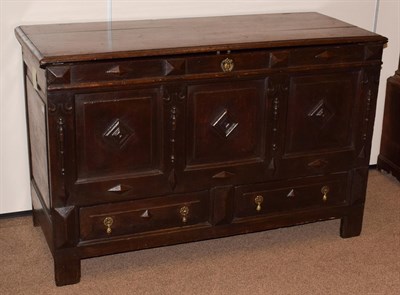 Lot 428 - A Late 17th Century Joined Oak Chest, the hinged lid with three moulded panels enclosing a...