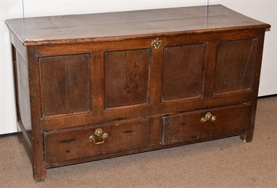 Lot 430 - An Early 18th Century Joined Oak Chest, the hinged lid above four moulded panels with two deep...