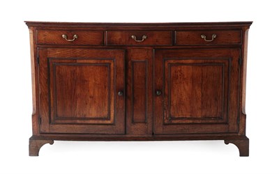 Lot 431 - An 18th Century Oak Enclosed Dresser Base, the boarded top above three frieze drawers with two...