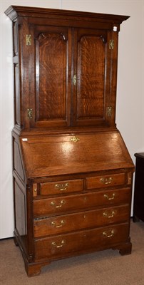 Lot 441 - An 18th Century Oak Bureau Bookcase, the moulded cornice above twin panelled doors, shelved...