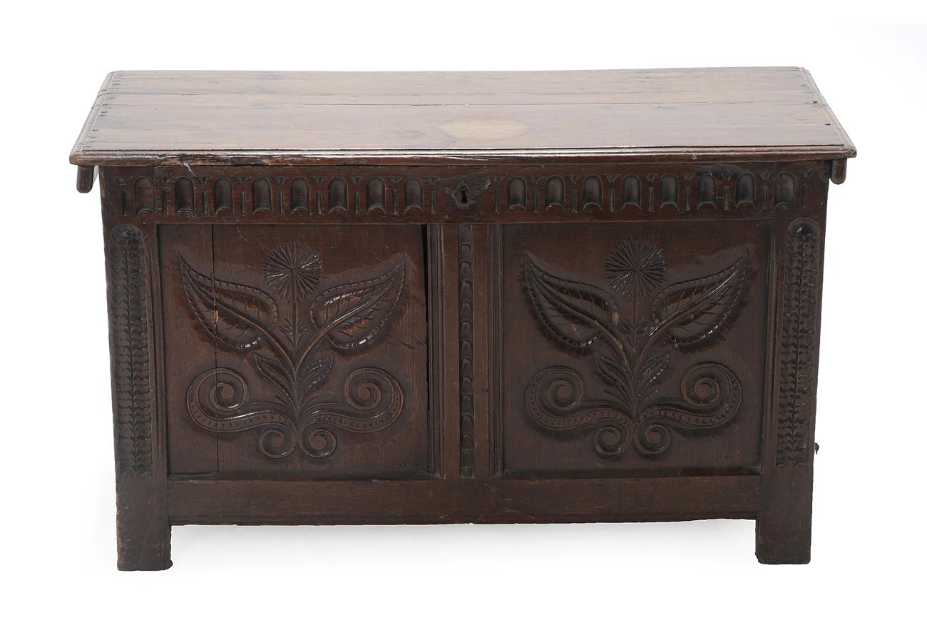 Lot 443 - A 17th Century Joined Oak Chest, the hinged lid with moulded edge above a nulled frieze with...