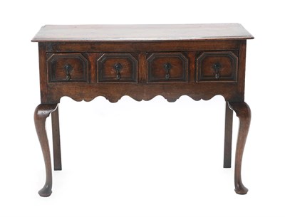 Lot 445 - An Oak Side Table or Small Dresser Base, in 17th century style, the moulded top above two geometric