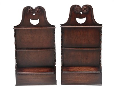 Lot 453 - A Pair of Oak Spoon Racks, each with a scrolled and rosette carved pediment and pierced...