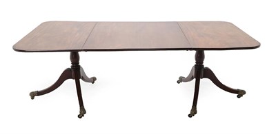 Lot 468 - A Regency Mahogany Twin-Pedestal Dining Table, early 19th century, of D shape form, with one...