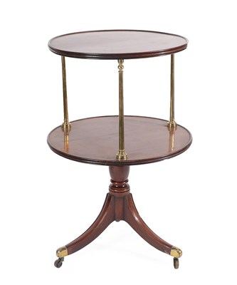 Lot 473 - A George III Mahogany Two-Tier Revolving Whatnot, early 19th century, of dished circular form...