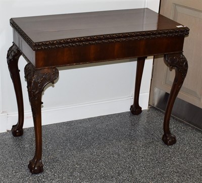 Lot 474 - A George III Style Carved Mahogany Foldover Tea Table, 19th century, of rectangular hinged...