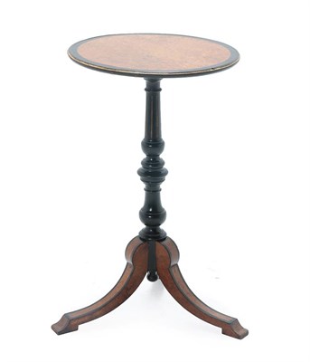 Lot 480 - A Victorian Ebonised and Amboyna Circular Tripod Table, late 19th century, of circular form, on...