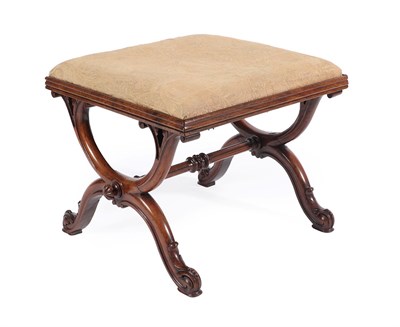 Lot 569 - Kendell & Co: A Victorian Walnut Dressing Stool, circa 1850, the worn floral overstuffed seat...