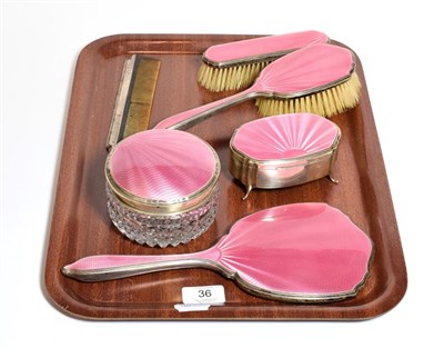 Lot 36 - A five-piece George V and George VI silver and pink enamel dressing-table service, by Barker...