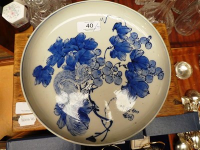 Lot 40 - A Japanese ceramic pedestal dish, painted in blue with foliage and animals, together with an...