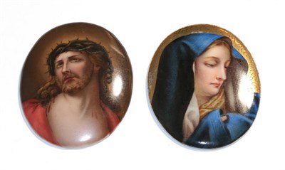 Lot 57 - Two oval Continental porcelain plaques, depicting Christ and Mary