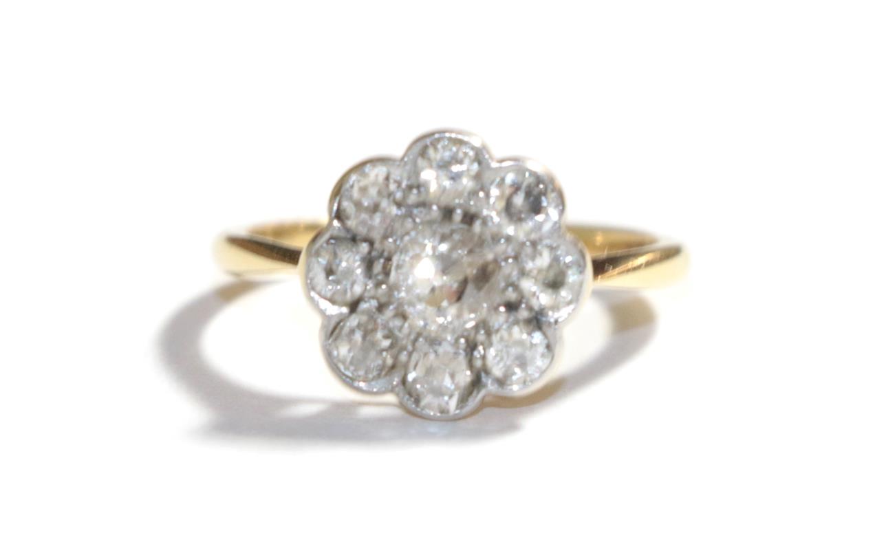 Lot 64 - A diamond cluster ring, stamped '18CT&PT', estimated diamond weight 0.70 carat approximately,...