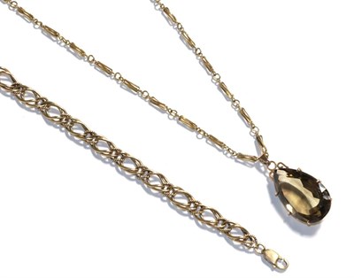 Lot 68 - A 9 carat gold fancy link bracelet, length 20cm and a smoky quartz pendant on a 9 carat gold...