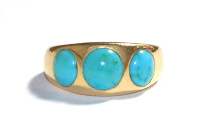 Lot 82 - A turquoise ring, the graduated round cabochon turquoise inset in a yellow plain polished...
