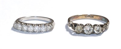 Lot 84 - A diamond seven stone ring, stamped 'PLAT, finger size K' and a paste three stone ring, stamped...