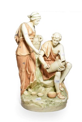 Lot 139 - An early 20th century hard case porcelain figure of male and female potters on a naturalistic base