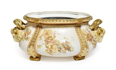 Lot 140 - A Doulton Burslem twin handled floral painted planter, the handles moulded as rams masks, 43cm wide