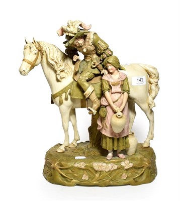 Lot 142 - A post 1919 Royal Dux model of a mounted caviller next to a flagon carrying maiden, model...