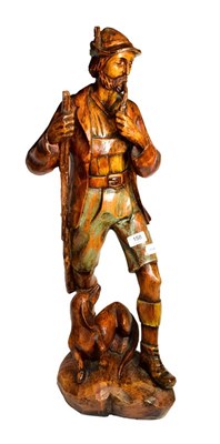 Lot 158 - A 20th century carved figure of hunter and hound in the Black Forest style, together with a...