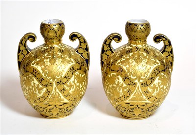 Lot 163 - A pair of Royal Crown Derby gilt decorated twin handled vases, 18cm high