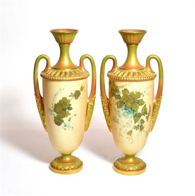 Lot 168 - A pair of Royal Worcester blush ivory floral painted twin handled vases, shape number: 2129,...