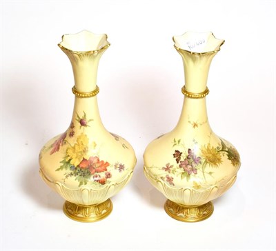 Lot 171 - A pair of Royal Worcester blush ivory floral painted vases, shape number: 1538, 27cm high