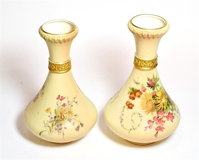 Lot 172 - A near pair of Royal Worcester blush ivory and floral painted vases, shape numbers: 2187, 27cm high