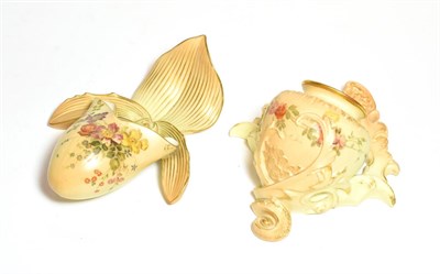 Lot 174 - Two Royal Worcester wall pockets, each painted with flowers on a blush ivory ground