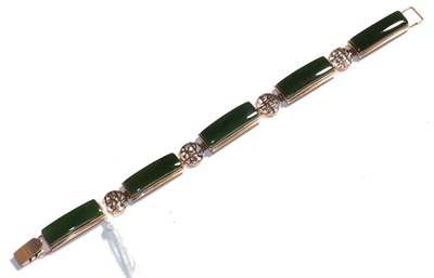 Lot 179 - A jade type bracelet, stamped '18K', length 18.5cm