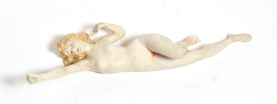 Lot 209 - An early 20th century German bisque figure of a nude young woman, unmarked, modelled stretching...