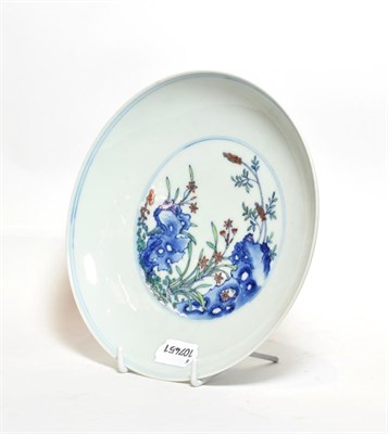 Lot 211 - A Chinese blue and white saucer dish, decorated with flowers and bearing six character mark