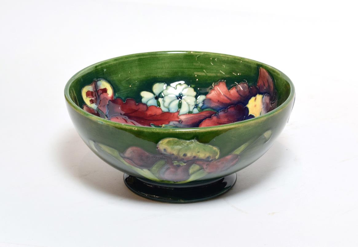 Lot 213 - A Walter Moorcroft 'Orchid and Spring Flowers' pattern bowl