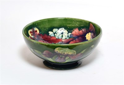 Lot 213 - A Walter Moorcroft 'Orchid and Spring Flowers' pattern bowl