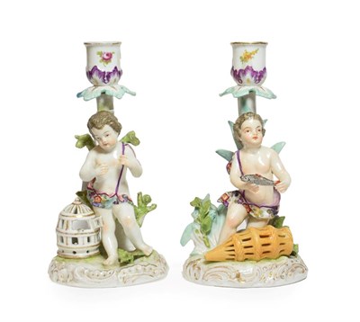 Lot 217 - A pair of 19th century German porcelain figural candlesticks