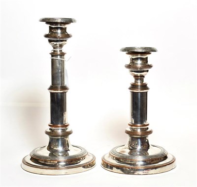 Lot 225 - A pair of Old Sheffield plate telescopic candlesticks, each on domed circular base, with plain stem