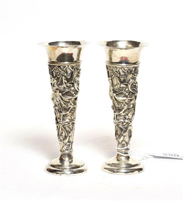 Lot 229 - A pair of Edward VII silver vases, by William Comyns, London, 1904, trumpet-shaped and on spreading