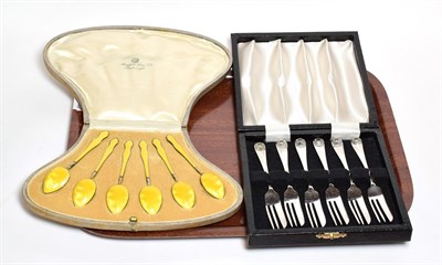 Lot 237 - Henry James Hulbert, a cased set of silver and yellow enamel coffee spoons, with import marks...