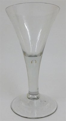 Lot 9 - A Glass Goblet, 18th century, the trumpet shape bowl on plain stem with air tear and circular foot