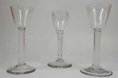 Lot 12 - A Wine Glass, circa 1770, the round funnel bowl on a double series opaque twist stem comprising...