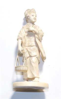 Lot 305 - Japanese ivory okimono of a girl carrying a basket