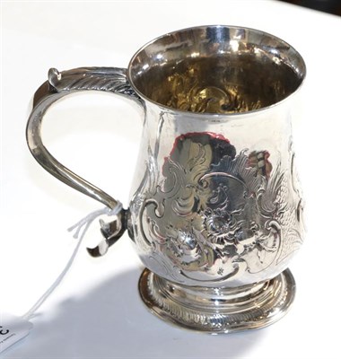 Lot 306 - A George III silver mug, unidentified makers mark J.S, London 1771, baluster on spread foot...