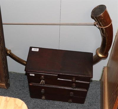 Lot 310 - A Victorian stain pine five drawer chest and a large brass horn