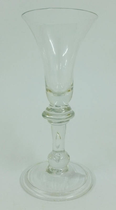 Lot 16 - A Baluster Wine Glass, circa 1730, the bell shaped bowl on an annular knop, the stem with air...
