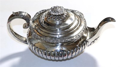 Lot 347 - A George III silver teapot, part gadrooned decoration, London 1822, possibly Robert Peppin, 21ozt